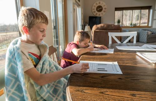 Alberta family reviewing tax paperwork for ACFB and adoption credits