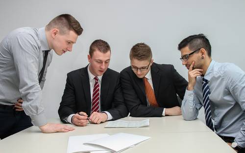 Modern Alberta business team with apprentices in a training setting