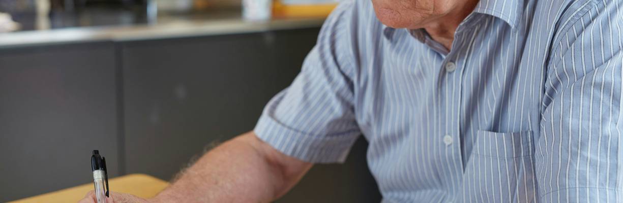 Canadian seniors reviewing tax paperwork at home