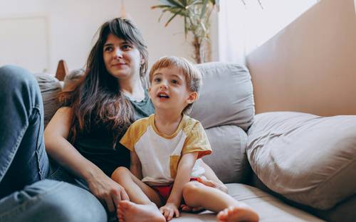 Family with child at home in Manitoba, representing family tax benefits