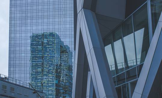 Modern Moncton business district skyline with office towers and a business team collaborating