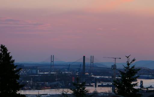 New Brunswick tax forms with Fredericton skyline in the background, representing provincial tax breaks in New Brunswick