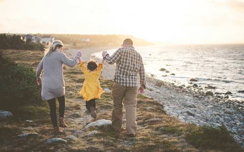 Nova Scotia parents with child reviewing paperwork for family credits