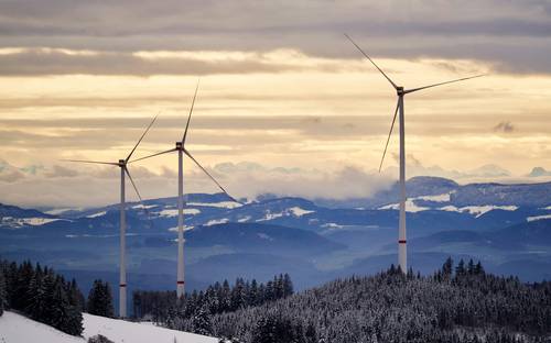 Nova Scotia wind turbines and solar panels with technician working on renewable energy project