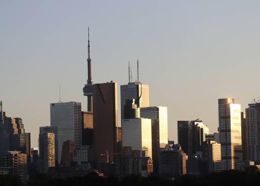 Modern Ontario business district with Toronto skyline and professionals in a corporate meeting