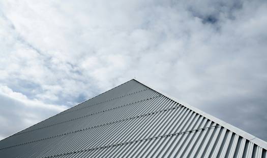 Ontario factory rooftop solar panels and wind turbines with a modern manufacturing plant
