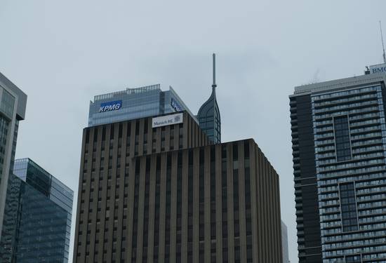 Modern Montreal business district skyline with office towers and a business team meeting
