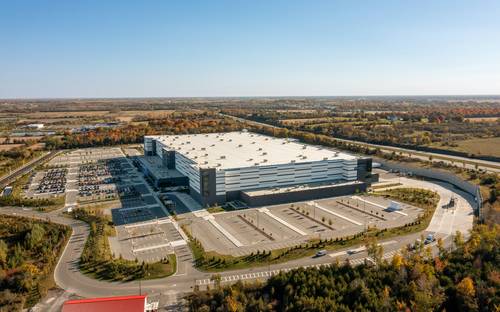 Quebec clean technology factory with solar panels and modern green manufacturing equipment