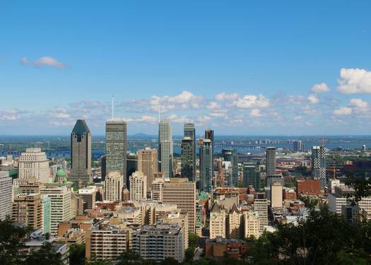 Quebec tax forms with Montreal skyline in the background, representing provincial tax breaks in Quebec