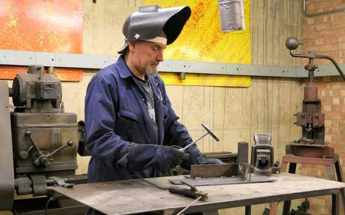 Saskatchewan business team and apprentices in an industrial training setting