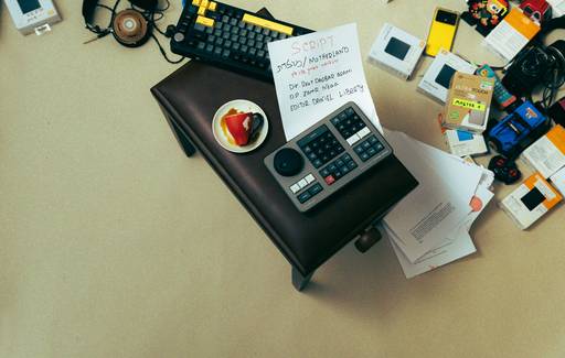 A Canadian freelancer at a home office desk sorting tax receipts and using a laptop for self-employed tax filing
